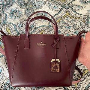 Burgundy Kate Spade leather crossbody purse.
